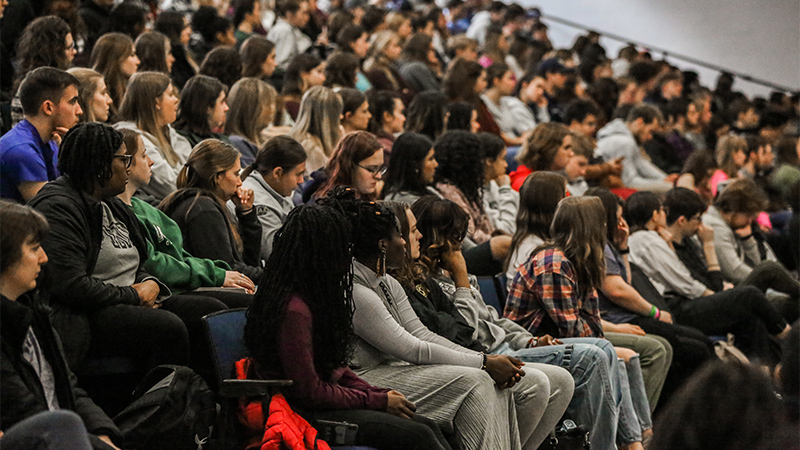 Indoor photo of students on bleachers
